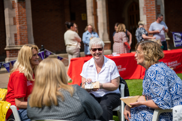Image shows staff having a picnic on the Quad to mark Mental Health Awareness Week